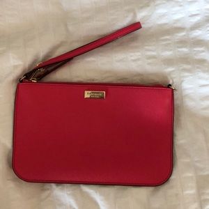 Coral pink Kate spade wristlet.